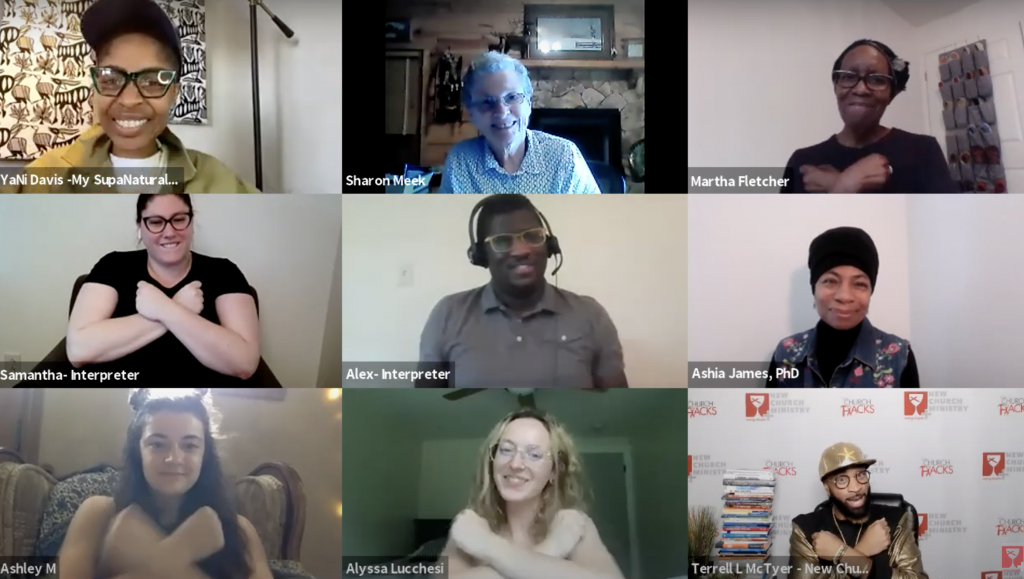 The image is a screenshot of nine participants in a Zoom meeting on providing communal care for deaf people. Five of them are making the American Sign Language sign for the word 'love.'